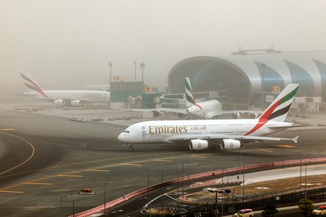 Airplane taxiing during a dust storm at Dubai International Airport.jpg