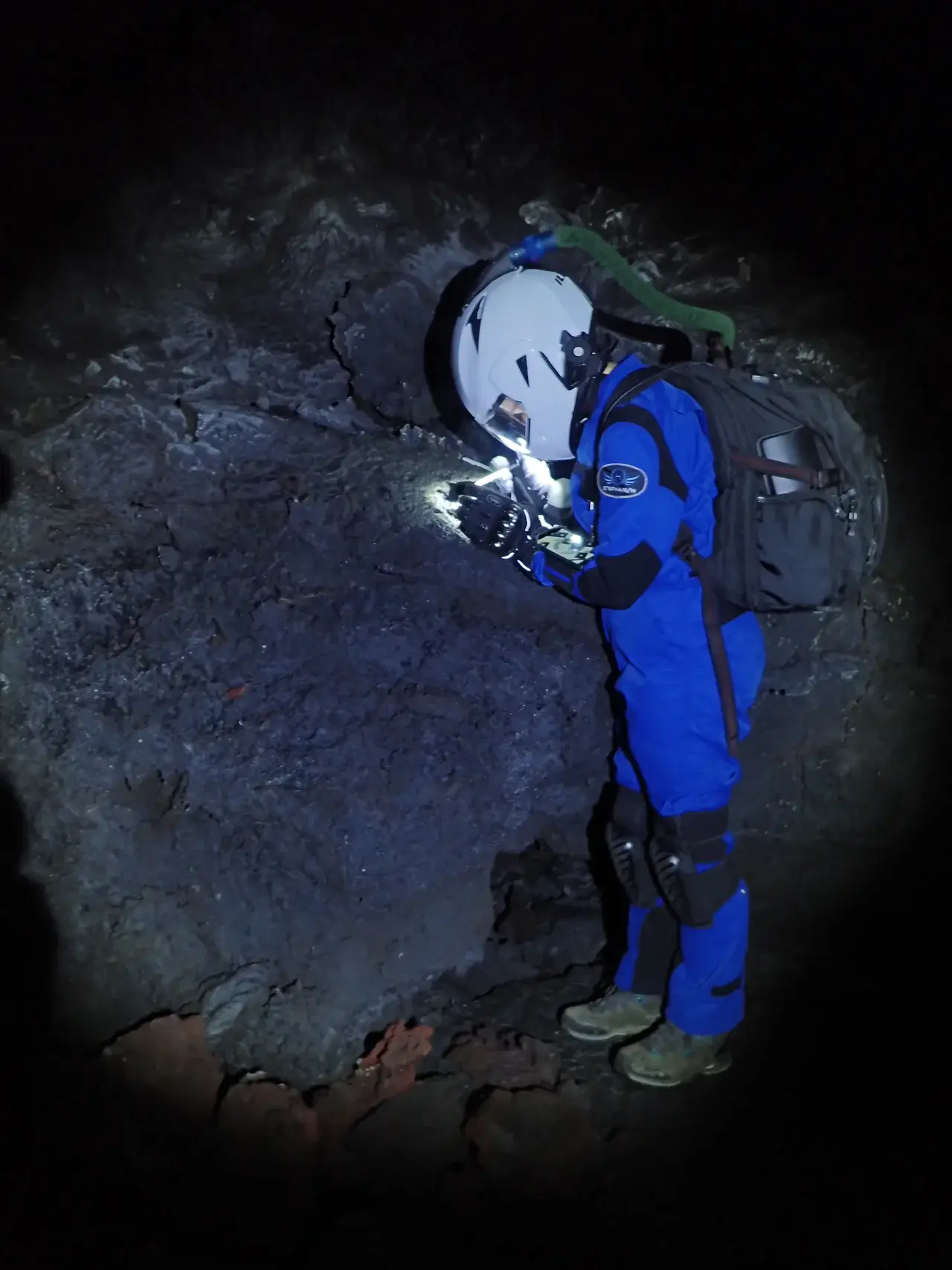HI-SEAS crewmember exploring Mauna Loa's lava tubes as analogs for lava tubes on Mars and the moon. (Credit: HI-SEAS)