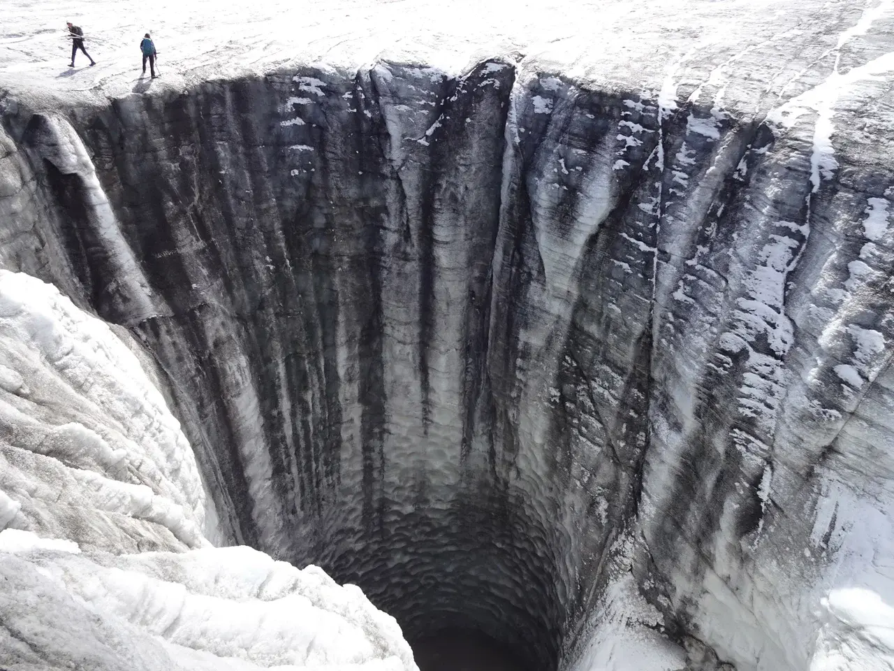 Large moulin (vertical shaft) on Plaine Morte glacier (Credit: M. Huss)