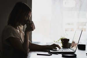 negative-space-woman-drinking-coffee-laptop-burst-thumb-1.jpg