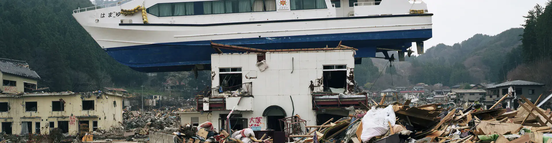 Boat dragged inland in Akahama, Japan by the 2011 tsunami (Credit: Stephen Vaughan)