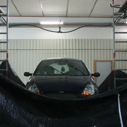 A car tested under a rain simulator