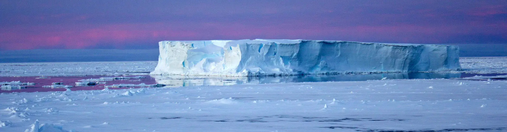 Tabular iceberg surrounded by sea ice in the Antarctic (Credit: Eva Nowatzki, distributed via imaggeo.egu.eu)