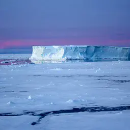 Tabular iceberg surrounded by sea ice in the Antarctic