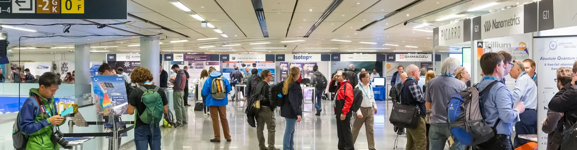 Participants in one of the exhibition areas at the EGU General Assembly (Credit: EGU/Foto Pfluegl)