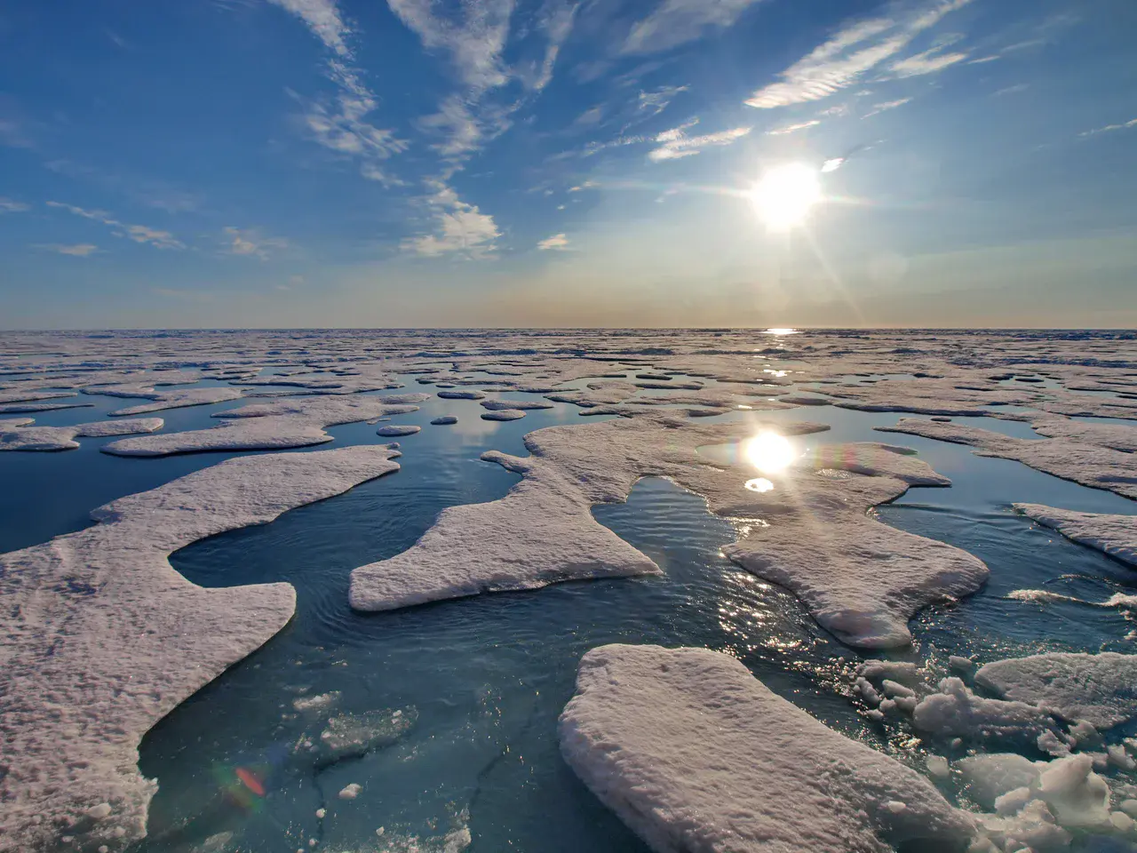 Ponds of melted freshwater (snow) on top of sea ice in the Arctic in summer. (Credit: Michael Tjernström, via Imaggeo)