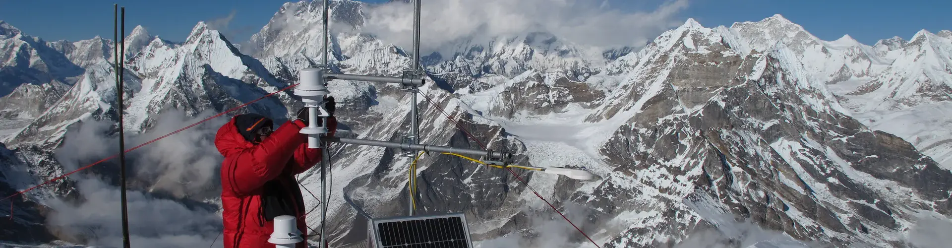 Taking measurements on Mera glacier in the Dudh Koshi basin (Everest visible in the background) (Credit: Patrick Wagnon)