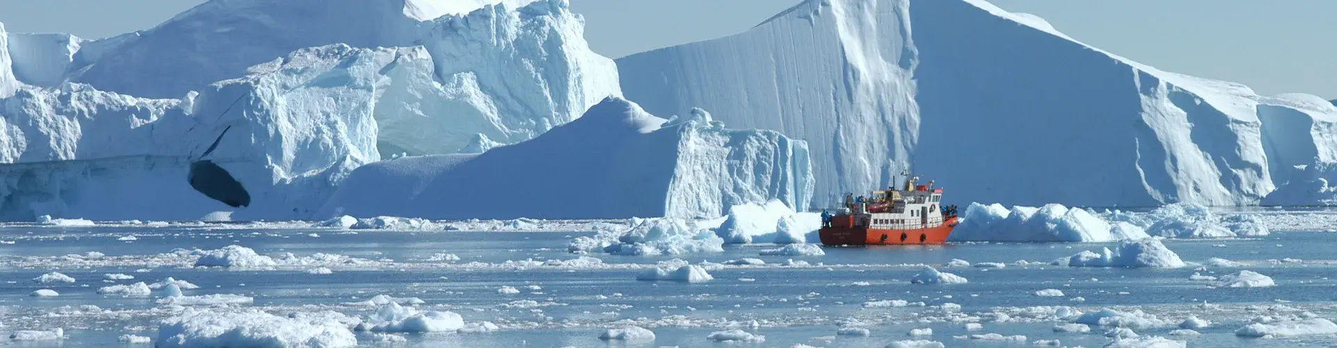 Iceberg losing ice to the sea in Greenland (Credit: Gerald Wetzel, distributed via imaggeo.egu.eu)