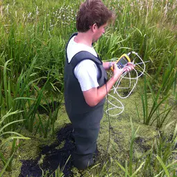 Rolf Hut testing the temperature-sensing waders in the field (2)