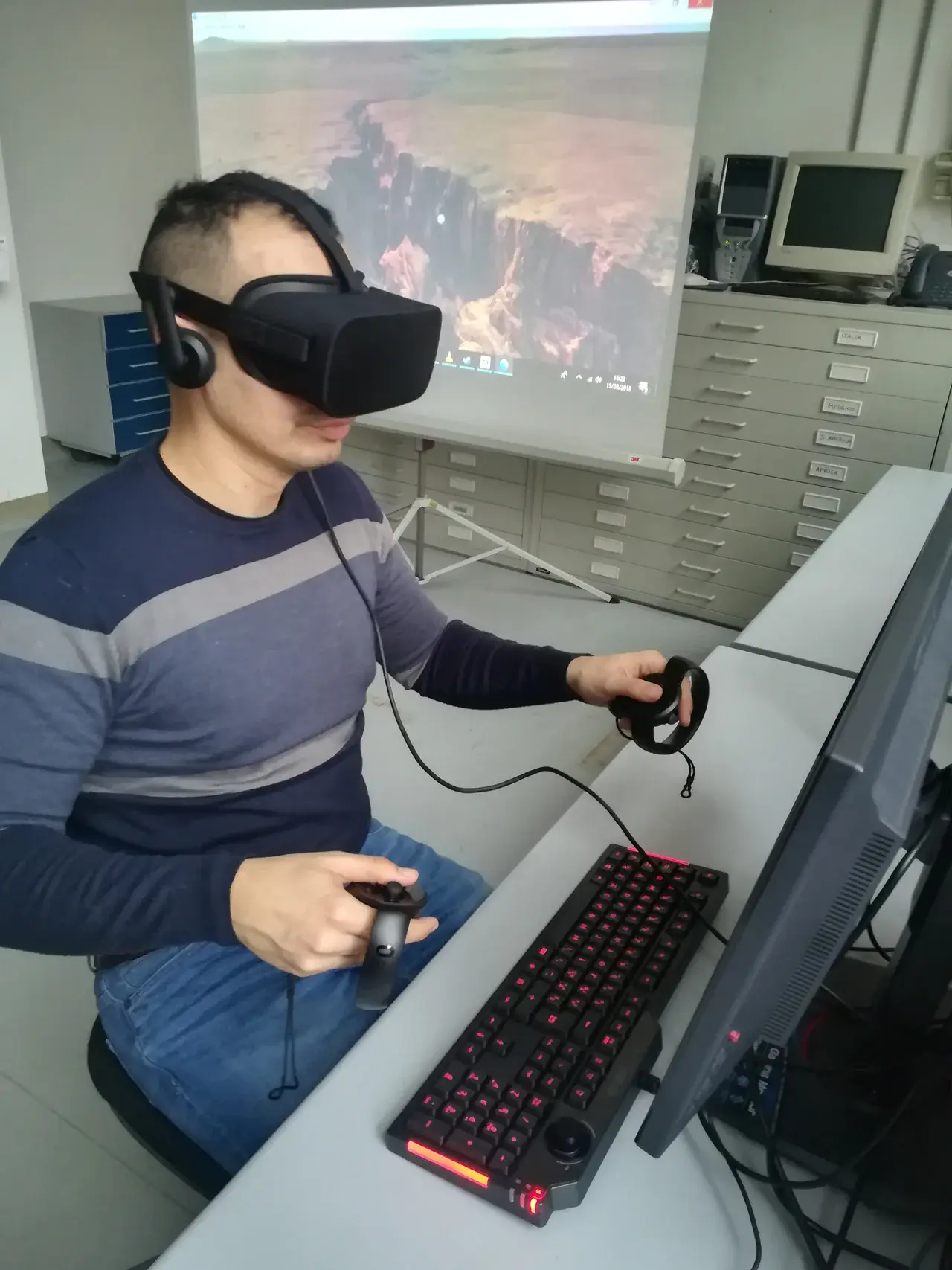 Fabio Bonali demonstrating the use of 3D goggles to explore geology-relevant landscapes (Credit: Fabio Bonali)