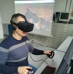 Fabio Bonali demonstrating the use of 3D goggles to explore geology-relevant landscapes