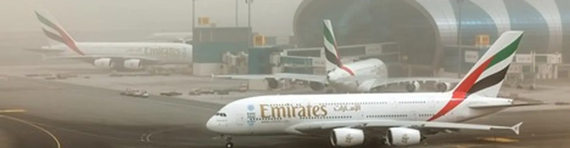 Airplane taxiing during a dust storm at Dubai International Airport.jpg