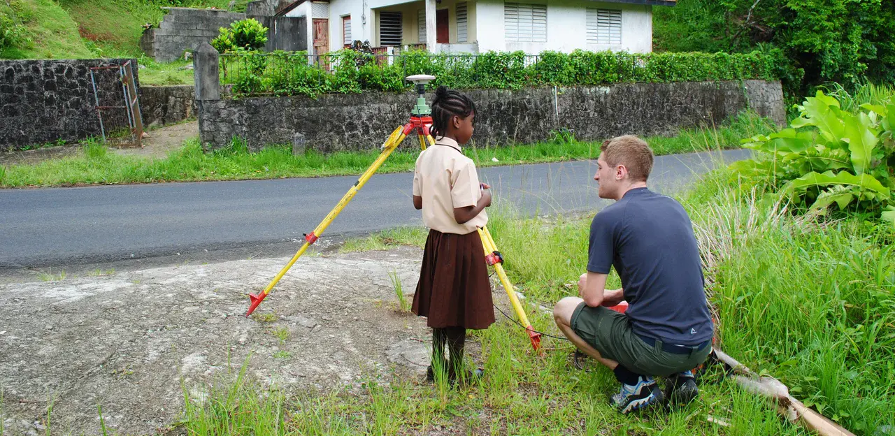 Volcanologist James Hickey combining outreach and fieldwork whilst in Dominica (Credit: Robert Watts)